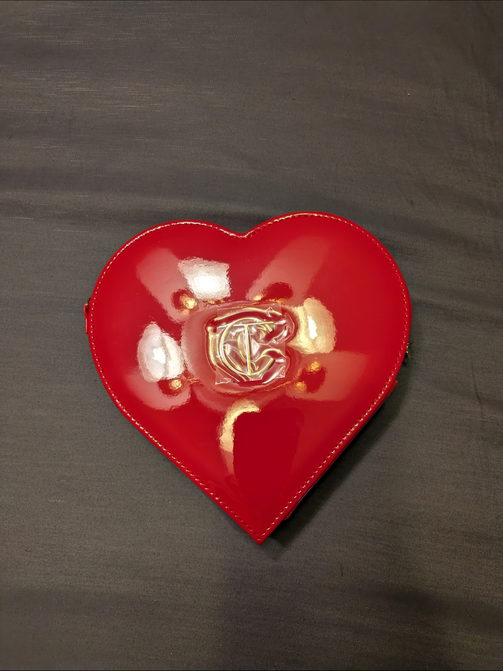 Red Heart-Shaped Crossbody Bag with Gold Logo